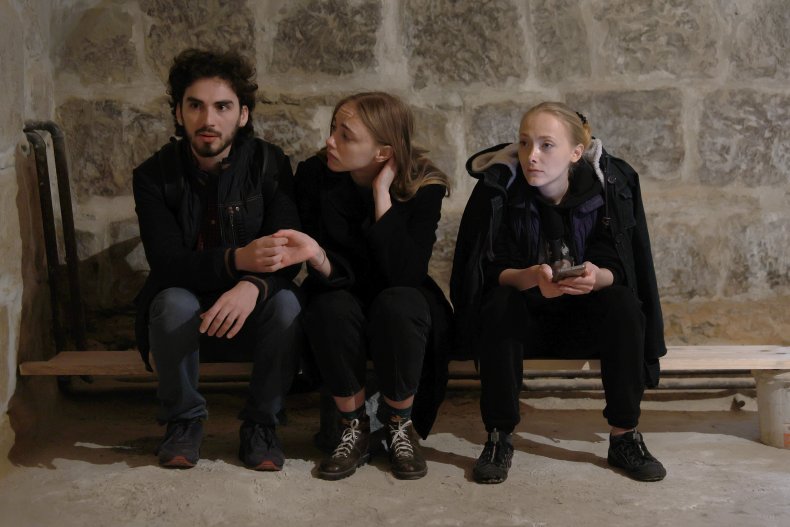 Ukrainians huddle in a bomb shelter