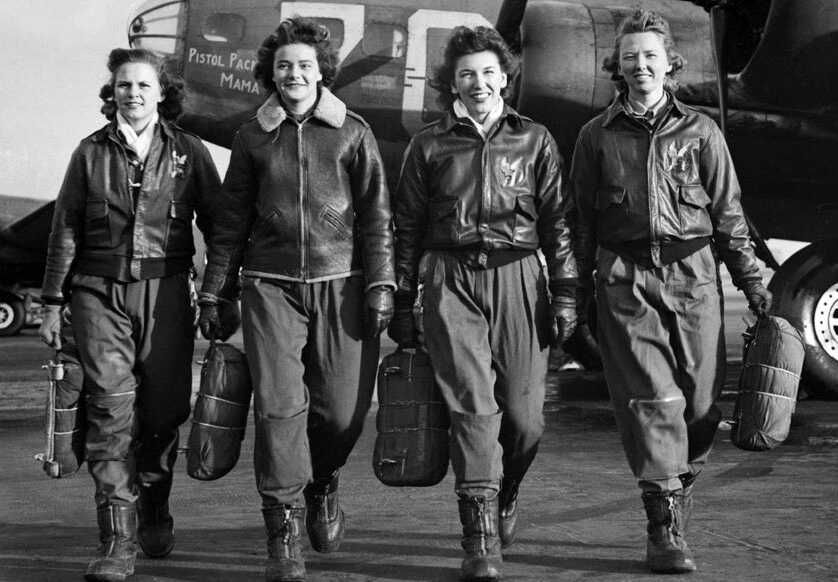 WASP (from left) Frances Green, Margaret Kirchner, Ann Waldner and Blanche Osborn leave their B-17, called Pistol Packin' Mama, during ferry training at Lockbourne Army Air Force base in Ohio. They're carrying their parachutes. (Photo: National Archives)