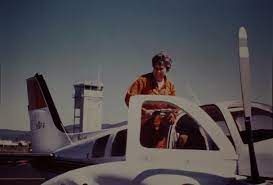Mary Barr standing on the wing of an airplane. (Photo: USFS)