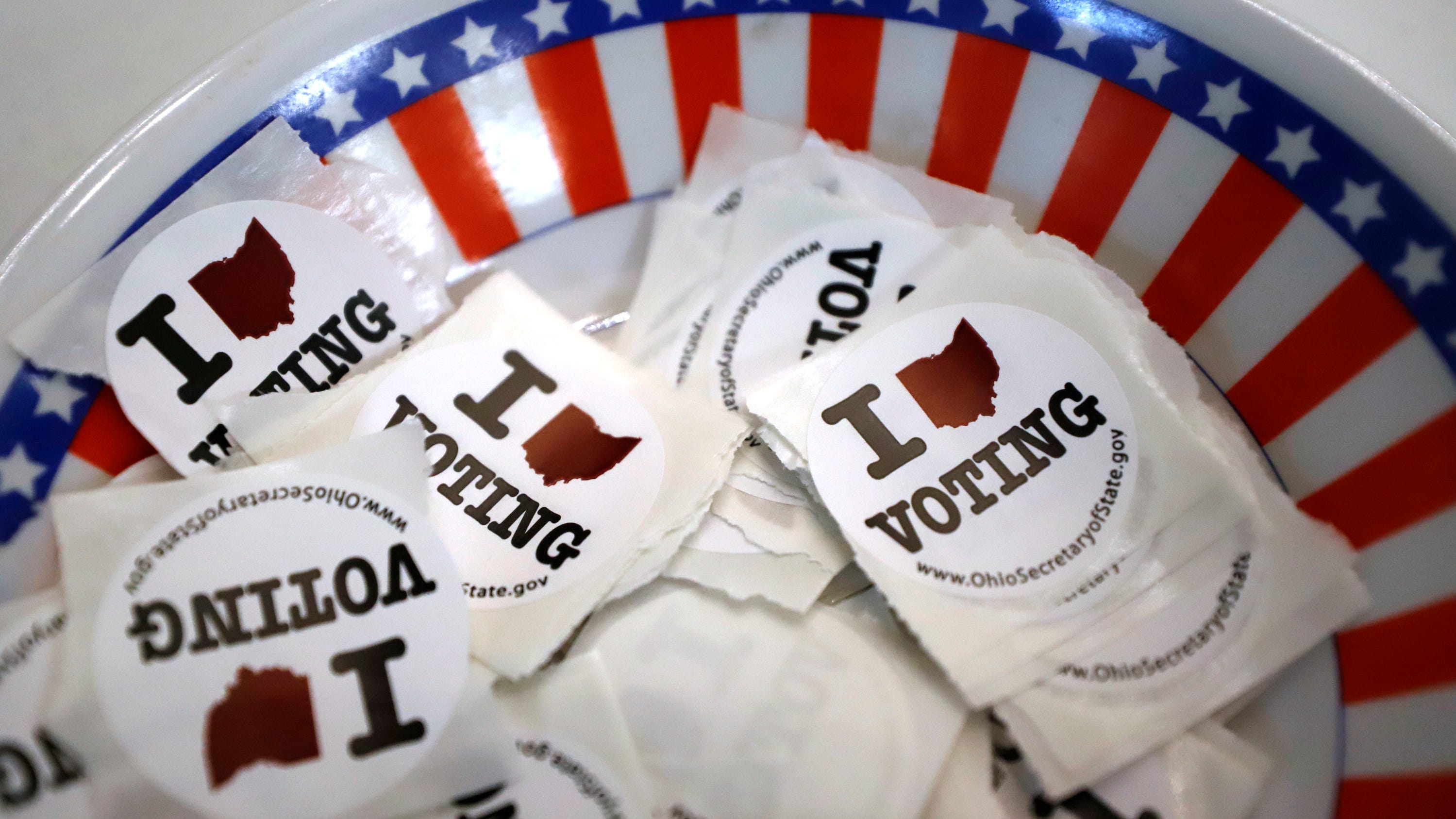 I voted stickers are seen at a polling place, Sunday, March 15, 2020, in Steubenville, Ohio. Elections officials in the four states, Arizona, Florida, Illinois and Ohio, holding presidential primaries next week say they have no plans to postpone voting amid widespread disruptions caused by the coronavirus outbreak. Instead, they are taking extraordinary steps to ensure that voters can cast ballots and polling places are clean. (AP Photo/Gene J. Puskar)