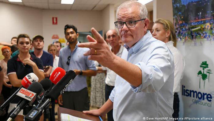 Australian Prime Minister Scott Morrison gestures during a press conference in Lismore, Australia, Wednesday, March 9, 2022.