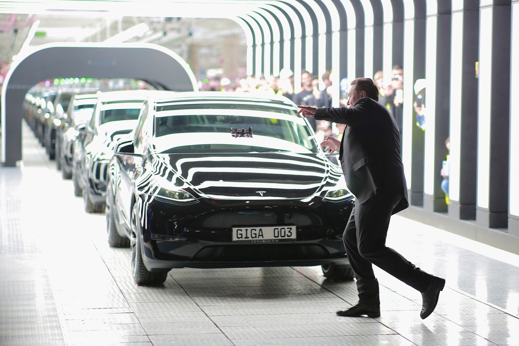 Tesla CEO Elon Musk poses with the Tesla vehicles during the opening day of the Tesla 'Gigafactory' in Gruenheide near Berlin, Germany.