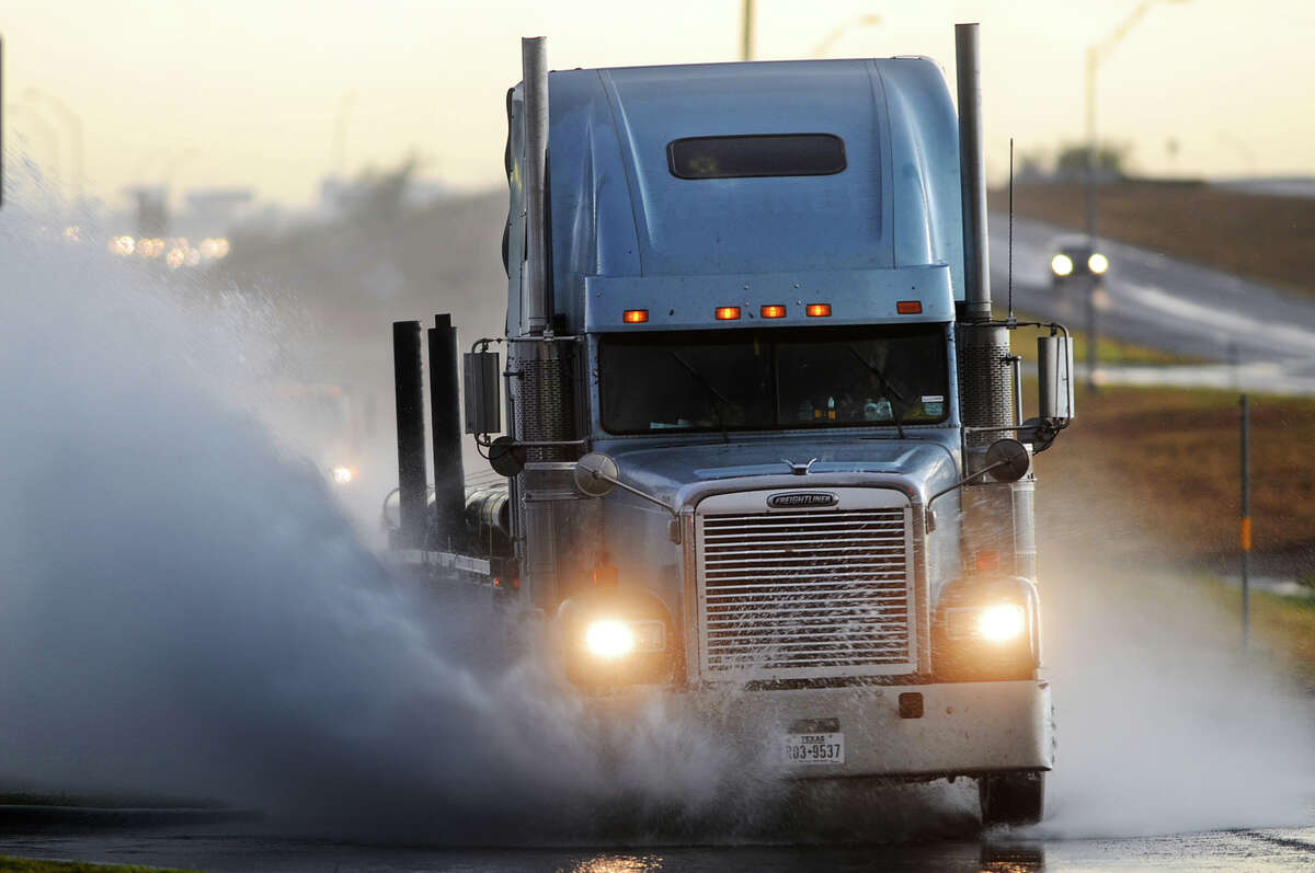 A semi truck drives through standing water on the south exit road near the intersection of Hwy 191 and Loop 250. Supply chain issues are causing companies to search for everything from adding more drivers, new equipemnt and more to help quell issues that have come up in recent months.