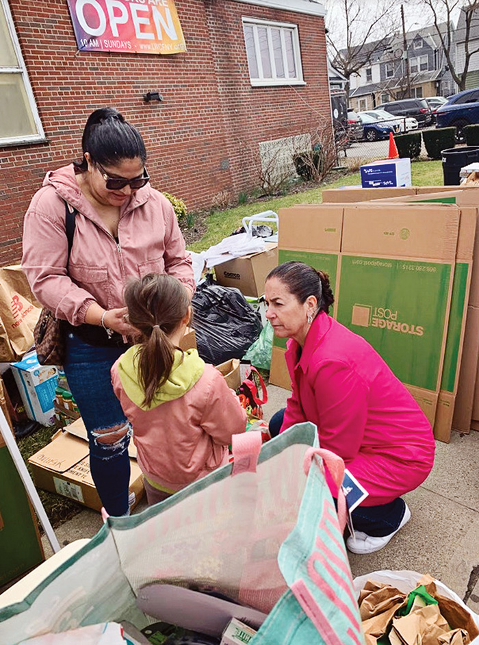Photo Courtesy of Assemblywoman Pheffer Amato Assemblywoman Pheffer Amato talks to a young volunteer.