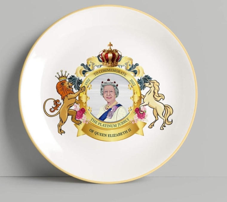 A white dinner plate featuring an image of the Queen - and the offending typo