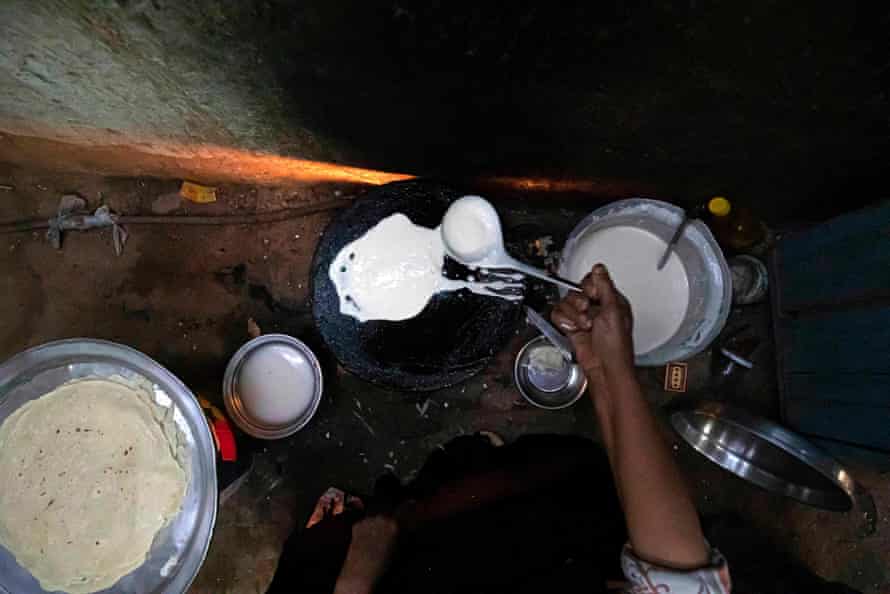 Umm Abdo prepares bread for the family in her home at Zerzara village on the west bank of the Nile river, near Egypt’s southern city of Aswan in February 2022.