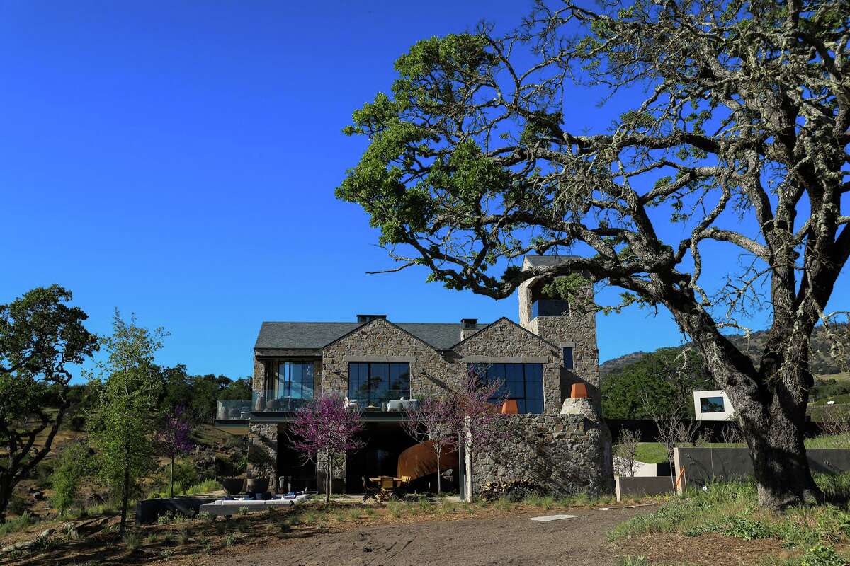 Roy Estate, above, in Napa is finally ready to welcome visitors after its owners rebuilt the winery and home as a modern take on the stone chateaus of Burgundy.