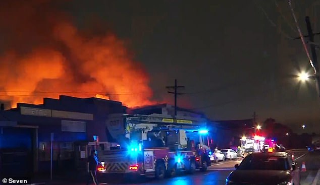 Firefighters are still unable to enter the gutted furniture building after the rood collapsed