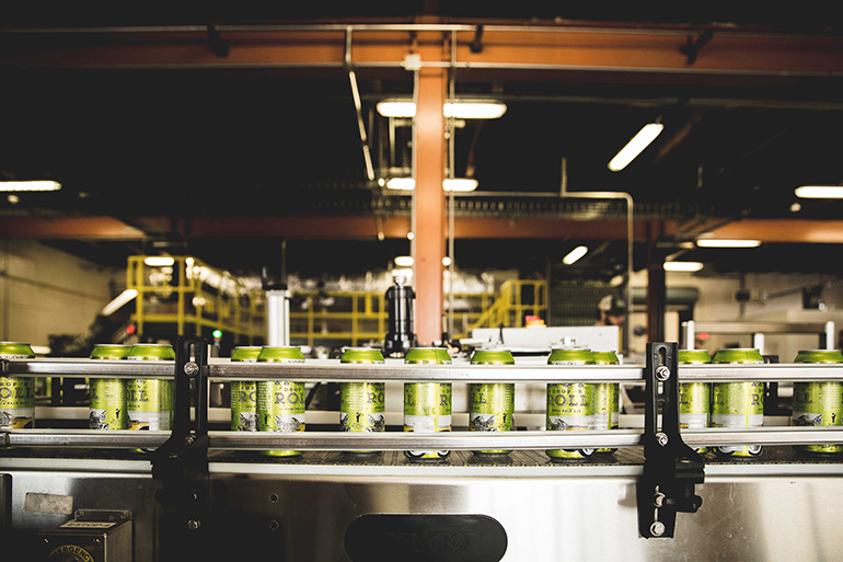 The beer canning process at NoDa Brewing