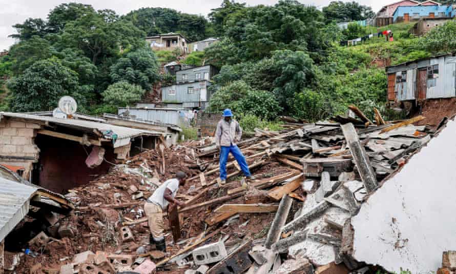 Residents salvage what they can from shattered homes in Durban after floods and landslips.