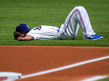 Texas Rangers shortstop Corey Seager stretches before the Rangers home opener against the...