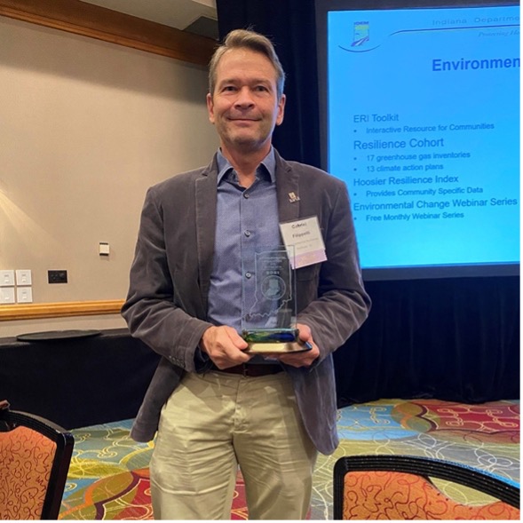 Dr. Filipelli holding the award for the Indiana University’s Environmental Resilience Institute from the Indiana govenor.