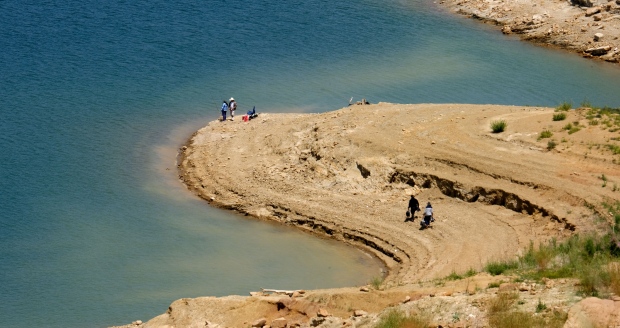 Fishermen have more land and less water at Castaic Lake,...