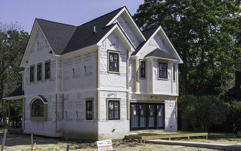 A construction site for a new single family home in Rochester, Michigan. A recent trend is to tear down older homes in smaller, but liveable communities, and replace them with large, modern homes.