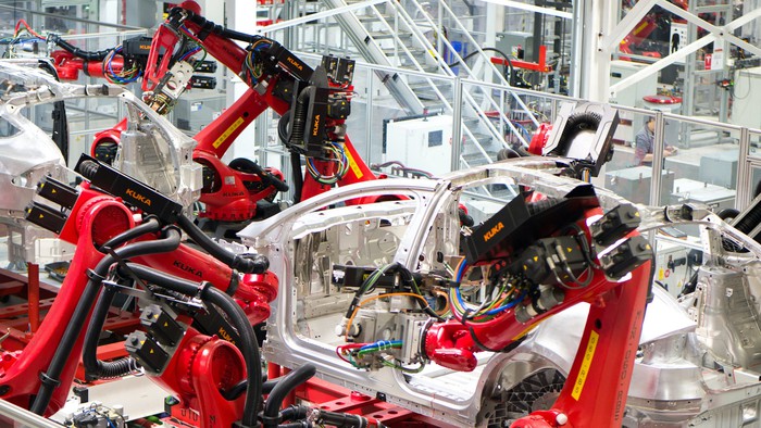A vehicle being assembled at a Tesla factory.