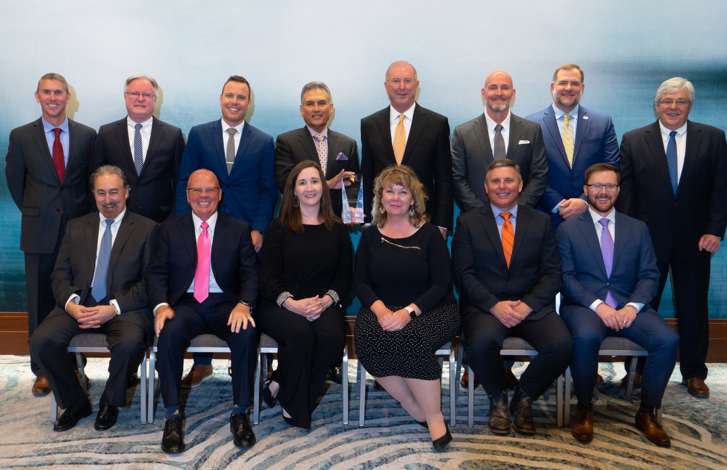 <p>Caption: Toyota Material Handling (TMH) recognizes 15 of the company’s top dealers with the prestigious President’s Award at their annual Dealer Meeting in Columbus, Ind., March 22, 2022. (Front Row Left to Right: Ken Townsend, Toyota Lift of South Texas; Ron McCluskey, Brodie Toyota-Lift; Anika Conger-Capelle, Conger Toyota-Lift; Joyce Schwob, JIT Toyota-Lift; David Bailey, Southern States Toyotalift; Kyle Hudson, Western Materials Handling & Equipment Ltd.; Back Row Left to Right: Chris Frazee, ProLift Toyota Material Handling; Larry McKevitt, Summit ToyotaLift; Mark Andres, Toyota Material Handling Northern California; Shankar Basu, Toyota Material Handling Solutions; Jim Shoppa, Shoppa’s Material Handling, Ltd.; Jeff Burns, Kenco Toyota-Lift; Michael Turnmyre, VESCO Toyotalift; Scott Plummer, W.D. Matthews Machinery Co.; not Pictured: Brent Bahrns, Bahrns ToyotaLift.</p>
