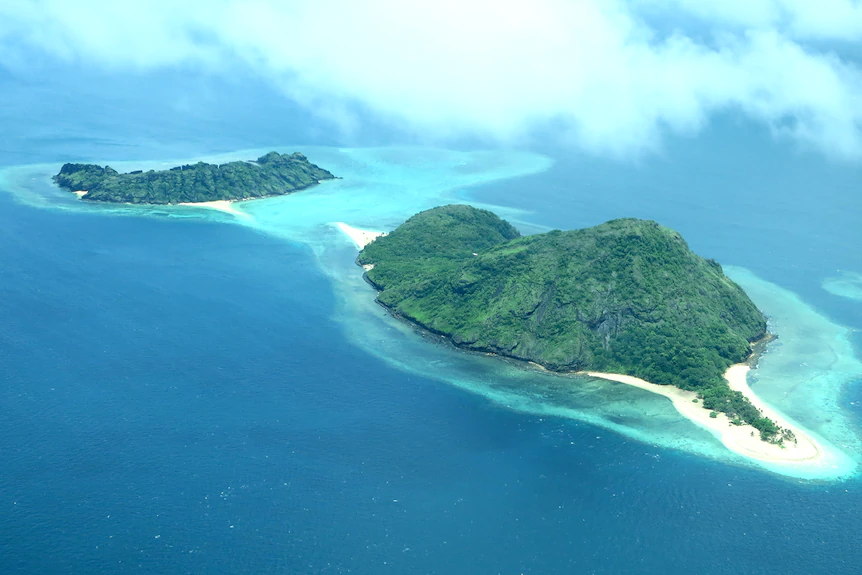 Two small tropical islands photographed from the air
