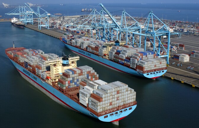 a ship with cargo on it in the harbor