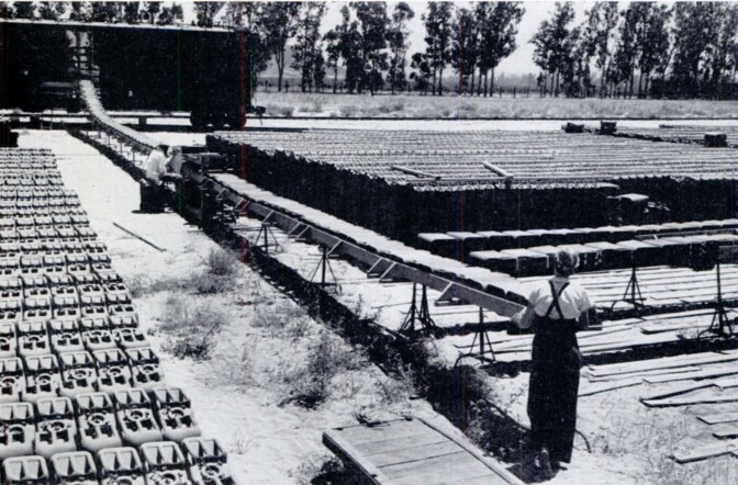 Women workers loading gas cans at Mira Loma Quartermaster Depot