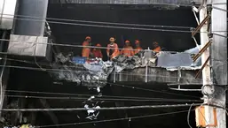 NDRF personnel carry out search and rescue operations at the building where a fire broke out that left at least 27 persons dead and 12 injured near Mundka Metro station, in Delhi on Saturday, May 14, 2022. (ANI Photo/Ishant Kumar)