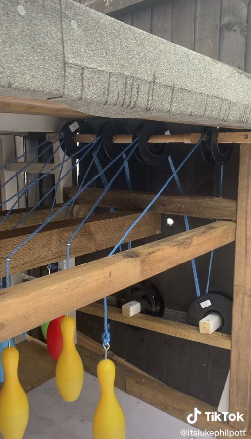 Luke attached the skittles to string and wheels so they could be reset after each bowl