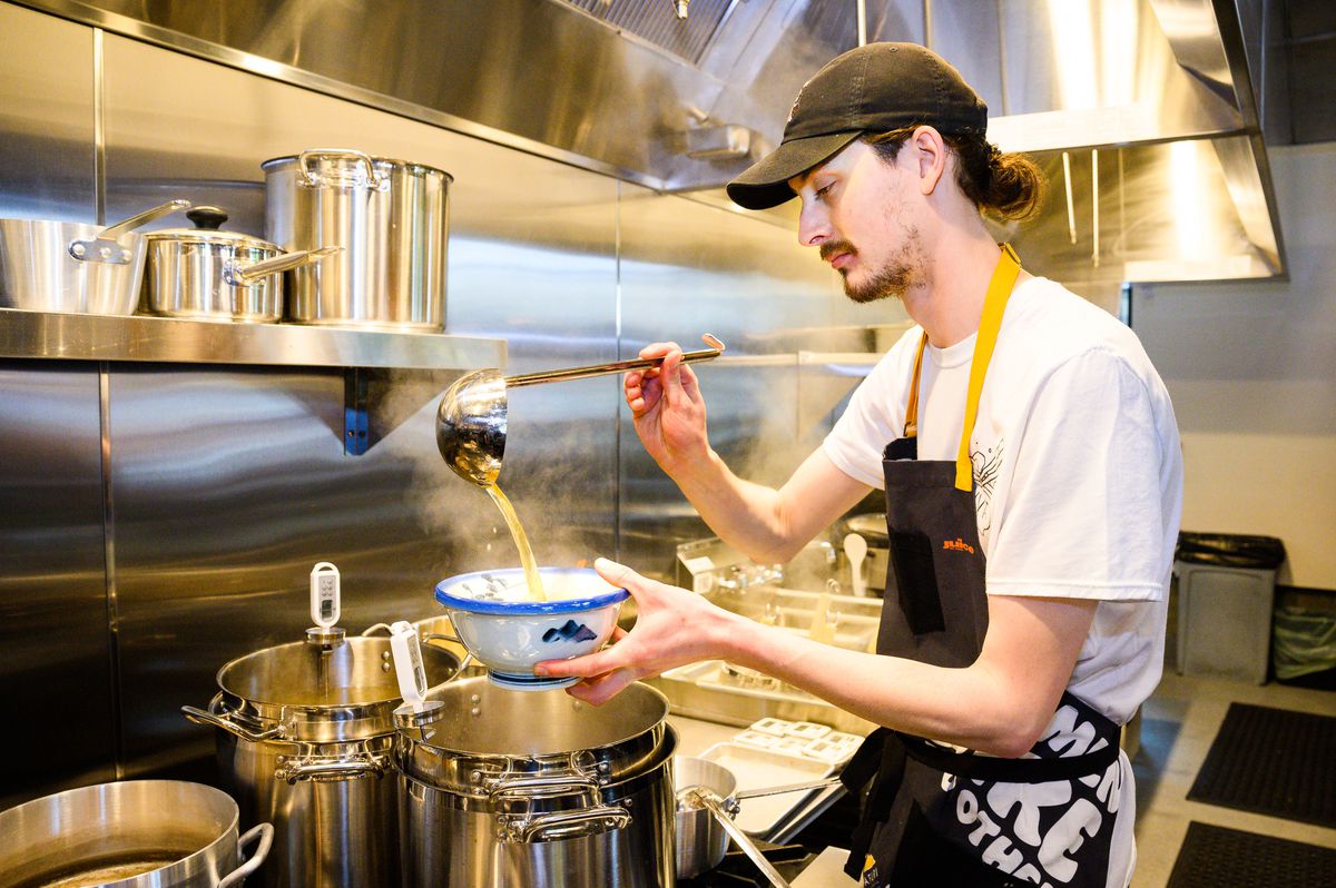 Executive Chef Chris Jenkins prepares yuzu shio ramen at the new Slabtown location for Tokyo-based ramen chain Afuri on Monday, May 16, 2022.