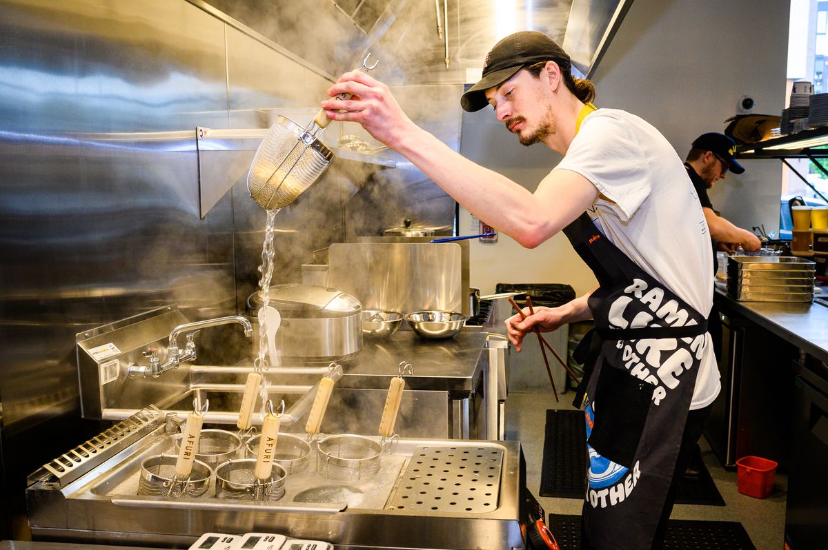 Executive Chef Chris Jenkins prepares yuzu shio ramen at the new Slabtown location for Tokyo-based ramen chain Afuri on Monday, May 16, 2022.