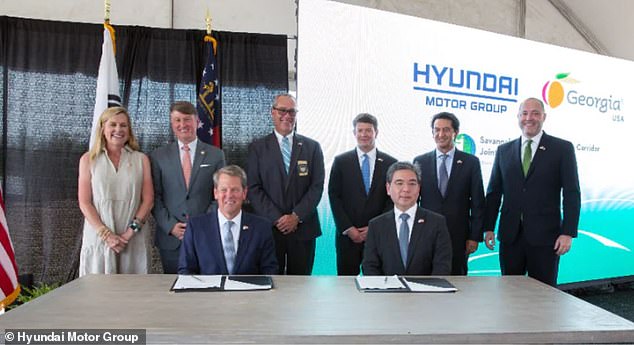 Georgia's Republican Gov. Brian Kemp (left) appeared at a signing ceremony Friday alongside Hyundai Motor Group Executive Chair Euisun Chung (right) to formalize the Korean motor giant's investment in the Peach State