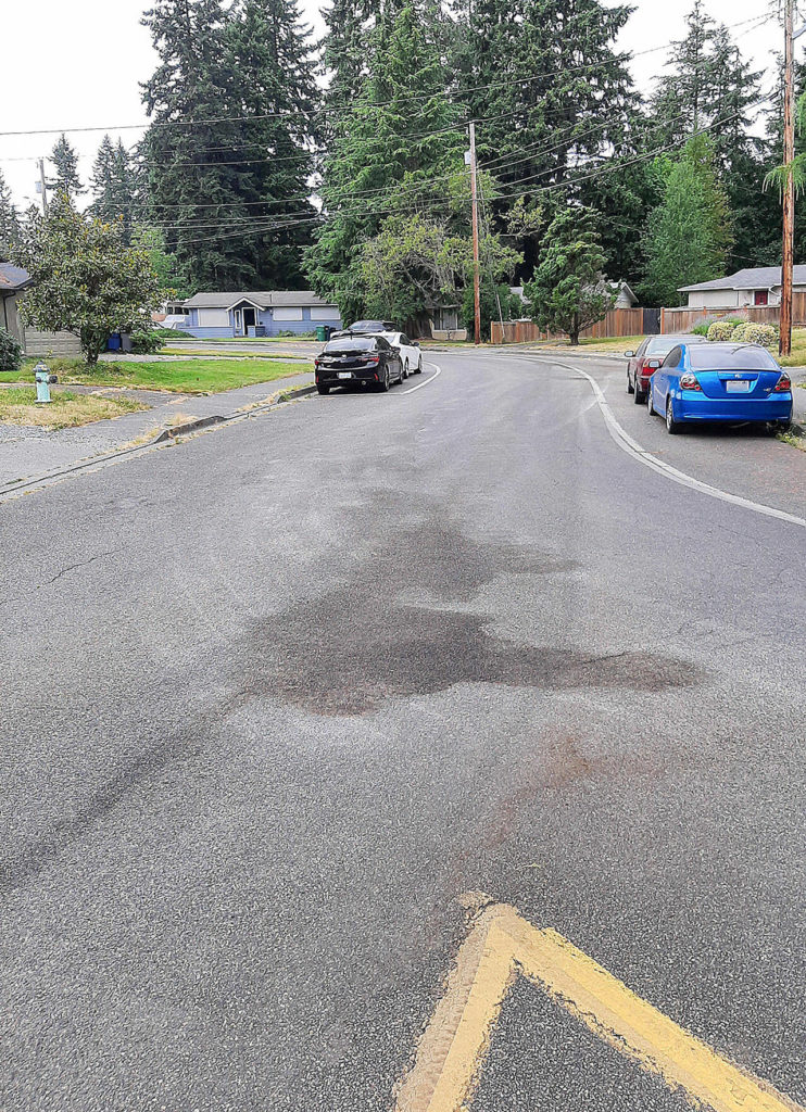 Waste Management hired a company to try to wash out hydraulic fluid that leaked onto Mountlake Terrace roads in late June 2021. (City of Mountlake Terrace)
