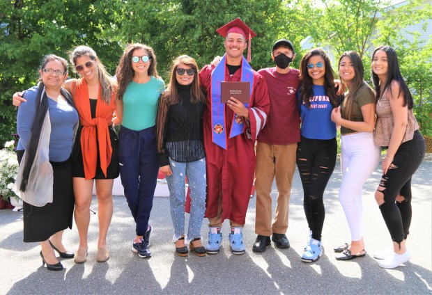 Goodrich Academy Class of 2022 senior Mathews Cardeal celebrated an early graduation on May 23 at the Fitchburg school surrounded by family including his father, mother, sister, and cousins. (DANIELLE RAY/SENTINEL & ENTERPRISE)