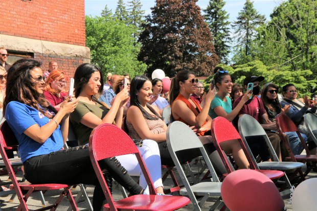Goodrich Academy senior Mathews Cardeal's family beams with pride while capturing his special graduation ceremony held last Monday at the Fitchburg school. (DANIELLE RAY/SENTINEL & ENTERPRISE)