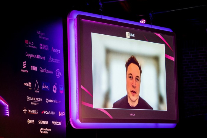 Tesla boss Elon Musk being interviewed at the FT car summit