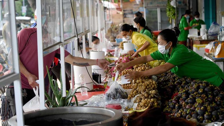 Women sell fruit at a shop in Phnom Penh in June of last year. Significant efforts need to be made to anticipate what lies ahead. In everything we do, we must listen to and work with both young and old, fostering intergenerational solidarity. And women must be at the centre of crisis-prepared policy action. afp Content image - Phnom Penh Post