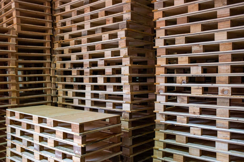 Stacks of custom, manually made pallets.