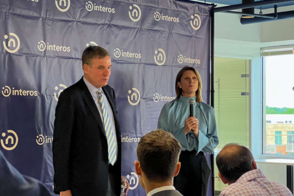 Sen. Warner and Interos CEO Jennifer Bisceglie (staff photo by Pia Kramer)