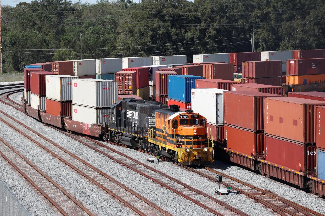 A commercial freight train carries a load of shipping containers at the Port of Savannah, Georgia, U.S. October 17, 2021. REUTERS/Octavio Jones