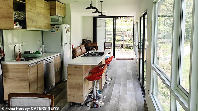 Inside the modern and spacious kitchen in Fiona's new home entirely fashioned from disused shipping containers