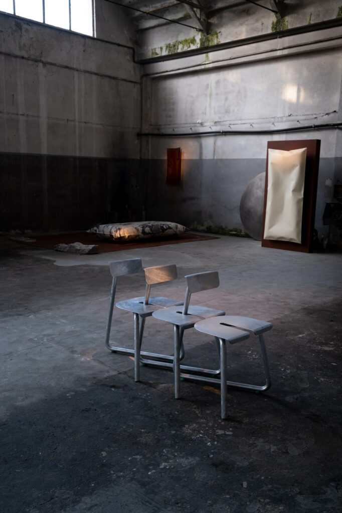 Instead of stackable, the chair is slidable for compact arrangement.