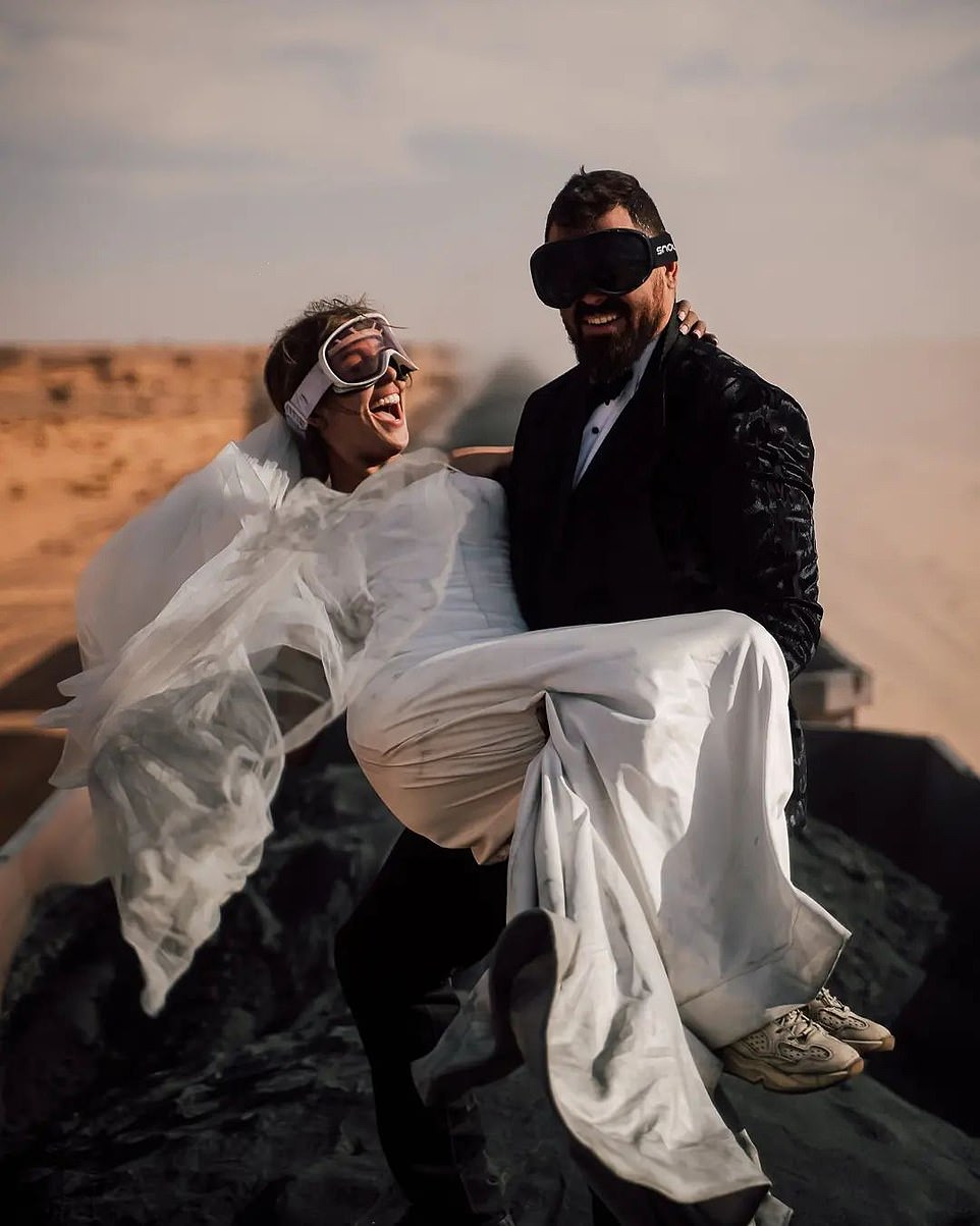 Travel influencers Kristijan Ilicic and his blogger wife Andrea Trgovcevic, from Croatia, posed for wedding pictures on the world's most dangerous 2km-long iron train through the Sahara Desert