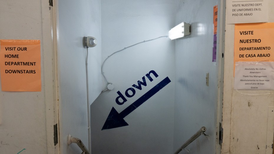 A sign pointing to the downstairs basement at Falla's