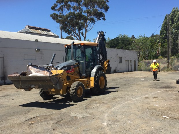 The city removes debris from an encampment on Reo Alley near Tennessee and Sacramento streets on Monday. (Thomas Gase -- Times-Herald)