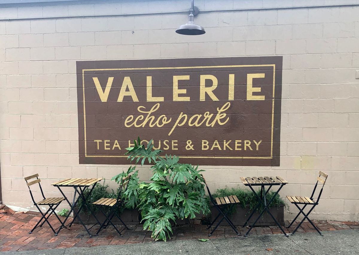 Outdoor table and restaurant signage at Valerie Echo Park.