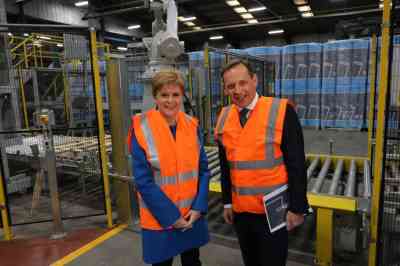 Nicola Sturgeon with Ken Munro, chief executive of Superglass, an insulation materials maker, at the opening of its factory in Stirling in 2019