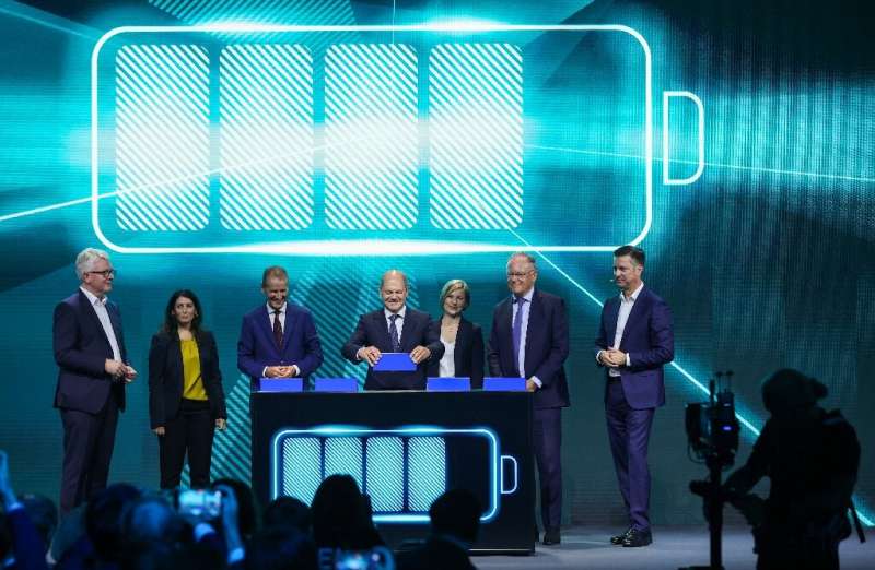 German Chancellor Olaf Scholz symbolically plugs in a battery as Volkswagen began construction of its first factory to make batteries for its electric cars. German Chancellor Olaf Scholz symbolically plugs in a battery as Volkswagen began construction of its first factory to make batt
