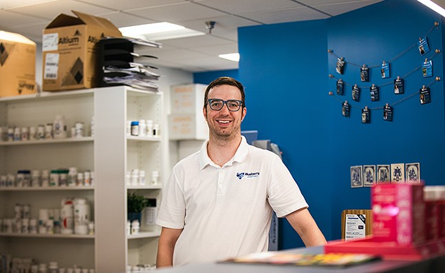 Pharmacist Kyle McCormick at work in Blueberry Pharmacy - CP PHOTO: RAYNI SHIRING