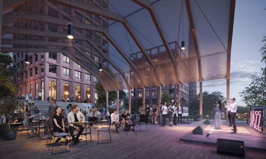 An area for local events at night with someone on stage