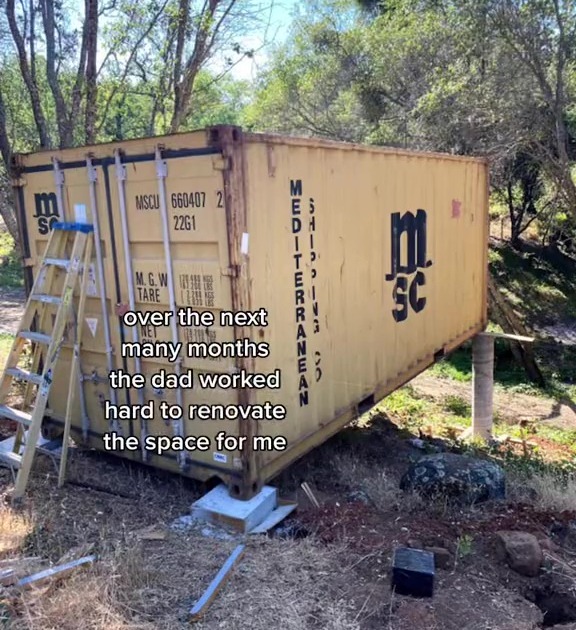 The shipping container was placed on a hill in the garden
