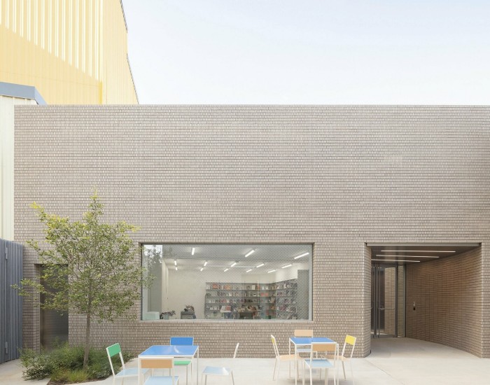 View of a courtyard and window showing bookshelves