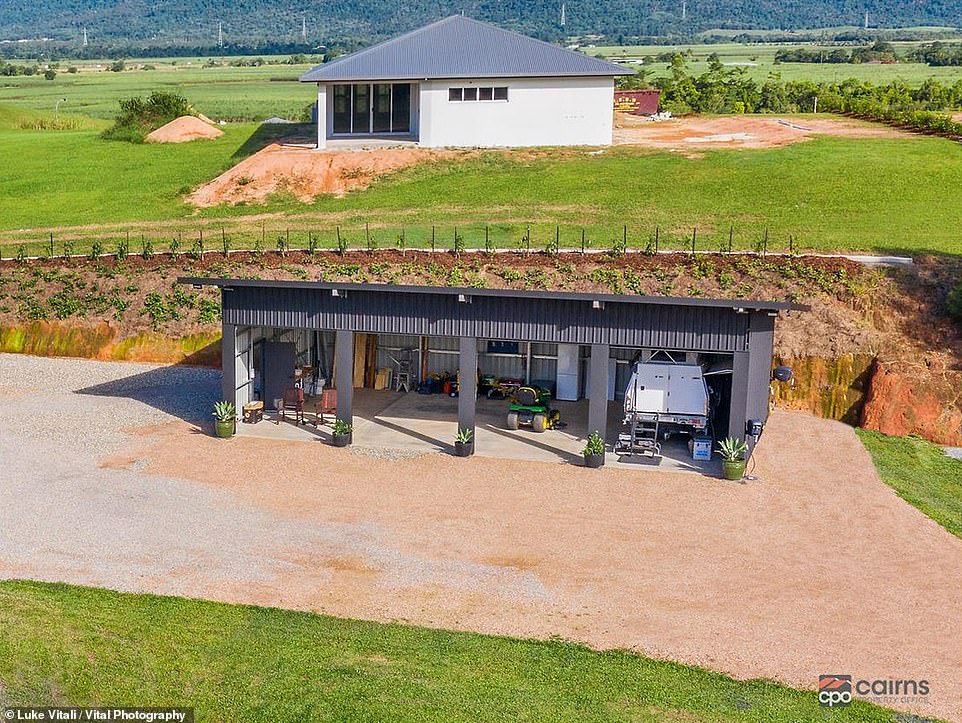 Next to the shipping container home is a massive four-bay shed with an open, un-walled wet area and toilet that is not for those after privacy