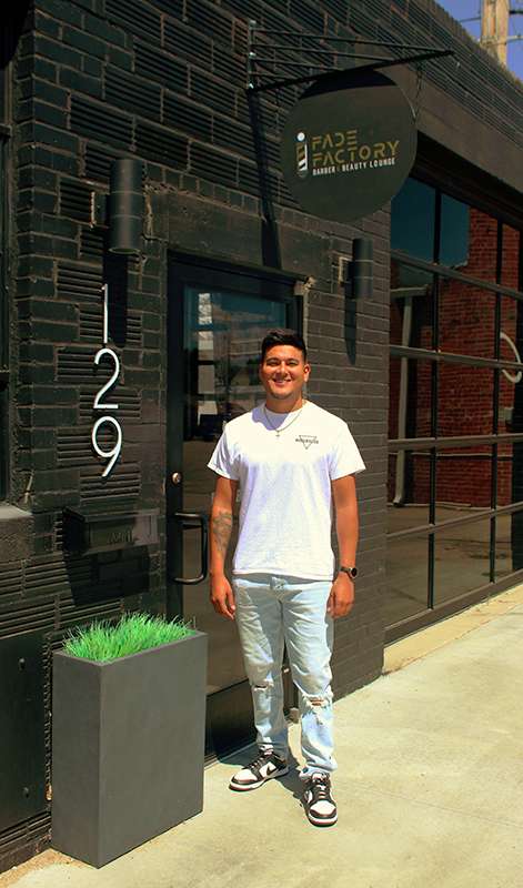 Vasquez specializes in intricate haircuts and bald fades with a razor. He creates team logos, numbers, zig-zag patterns or stars. Photo by Cristina Janney/Hays Post